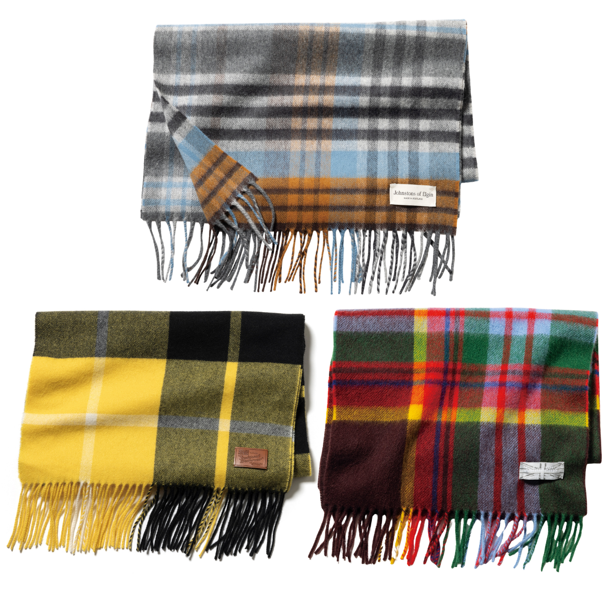 （上）マフラー¥36,300／ジョンストンズ オブ エルガン、（左）マフラー¥31,900／トラディショナル ウェザーウェア（トラディショナル ウェザーウェア 渋谷店、（右）マフラー¥39,600／ジョシュアエリス（真下商事）